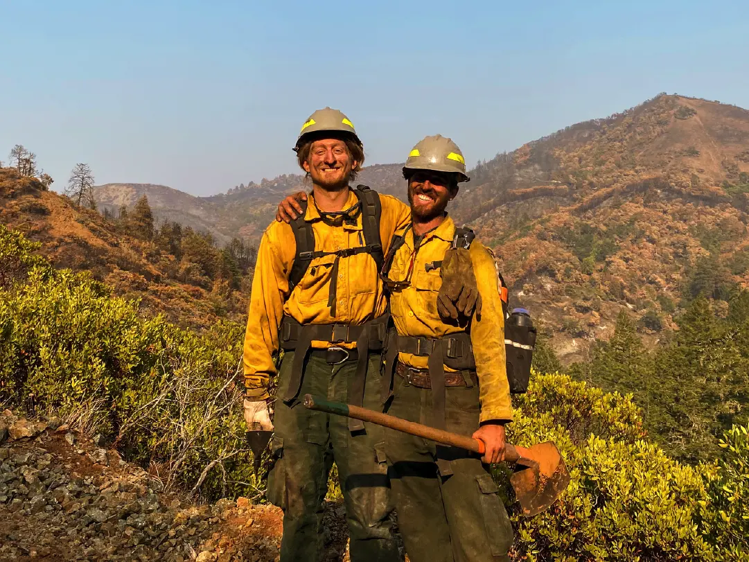 Ryan (left) poses with fellow crewmember, Michael Garrett, during wildfire operations on the Walbridge Fire near Cazadero, CA in Fall 2020.