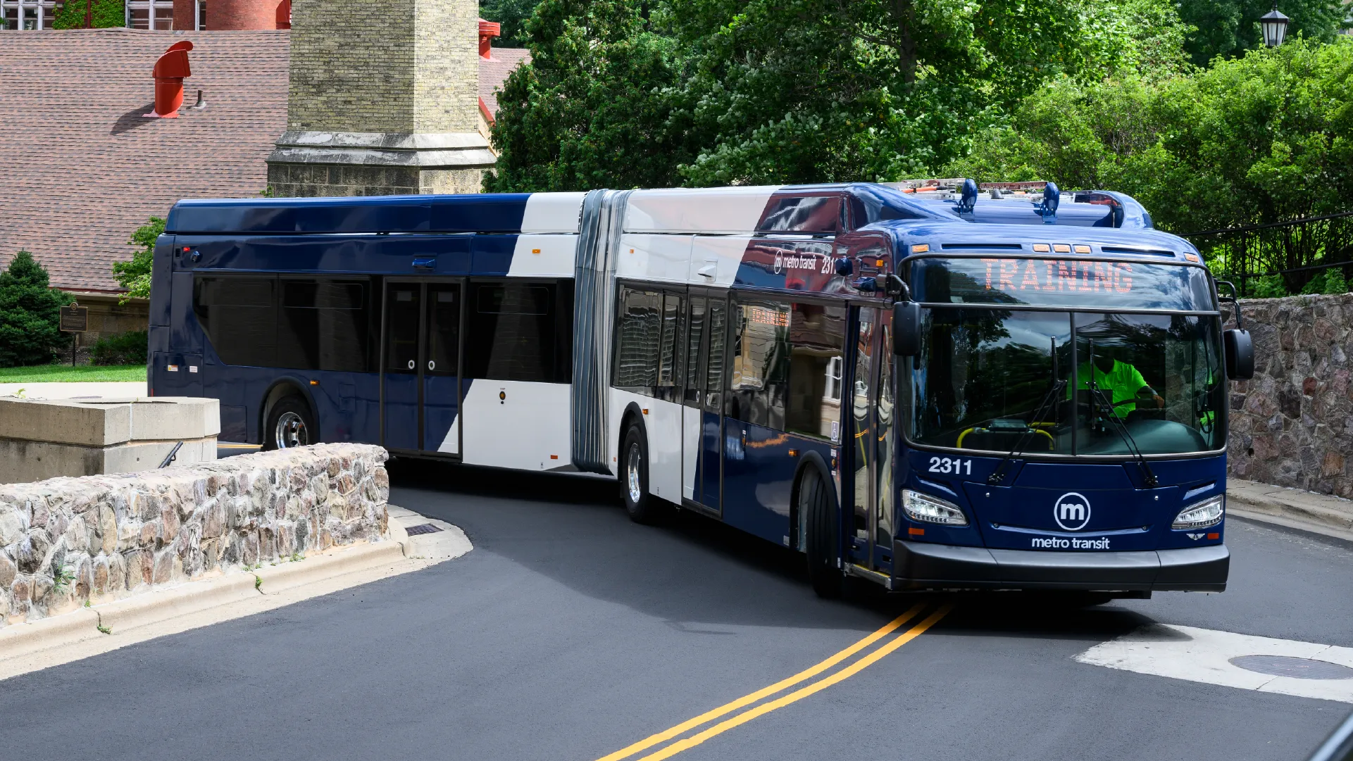 A new articulated electric bus takes a test drive on the hair-pin turns up Observatory Drive at the University of Wisconsin–Madison on July 17, 2024. Photo by Althea Dotzour / UW–Madison