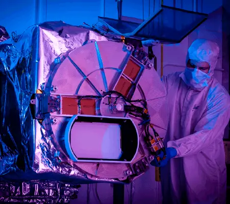 A Ball Aerospace technician inspects the Tropospheric Emissions: Monitoring of Pollution (TEMPO) instrument.