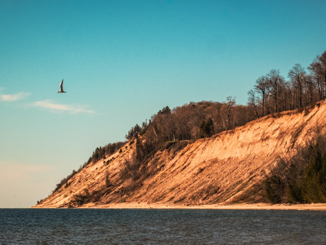 Large sand dune along the shoreline of the Great Lakes.