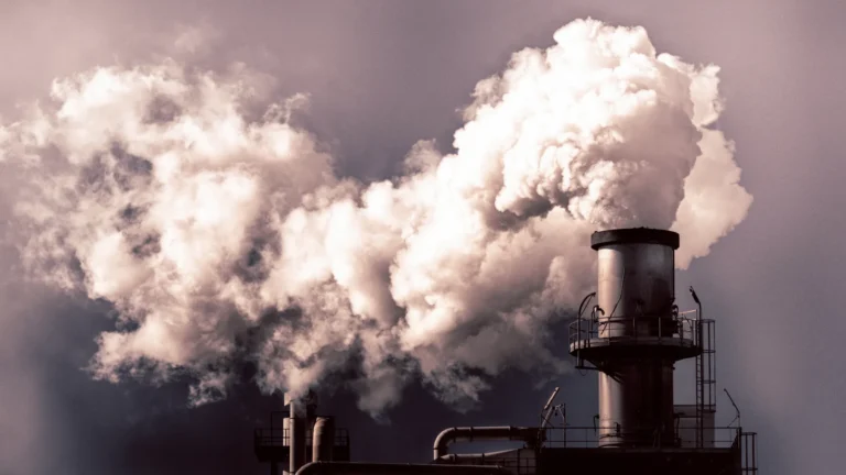 Pollution spewing from a power plant smoke stack.