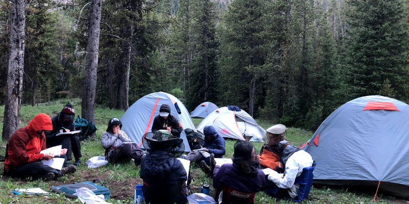 The Wild Rockies group sitting in a circle doing their daily readings, lessons, and group discussions. Photo credit: Alyse Bartol