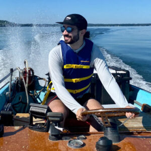 Bertalot pilots the Center for Limnology’s boat “Humpback” during a sampling day last summer. Photo by Ally Kundinger