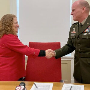 UW–Madison Chancellor Jennifer L. Mnookin and Brigadier General Dean Thompson, 353rd Civil Affairs Command, shake hands after signing the MOU between UW–Madison and the U.S. Department of Defense. Photo by Jason Gohlke