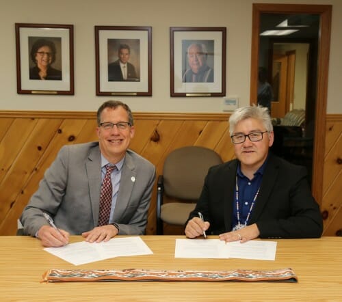 July: Leaders of UW–Madison and the College of Menominee Nation meet to sign a transfer-student agreement, a partnership facilitated by the Nelson Institute.