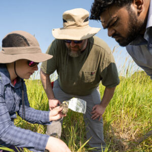 Heidi explaining hydric soil properties to two of her practicum cohort members in a private landowners field adjacent to Koshkonong Creek. Photo by Bryce Richter/UW–Madison