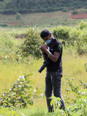 Igirimbabazi collects plant and animal photos in the southern province of Rwanda during iNaturalist training, which was organized by the National Geographic Society. Photo credit: CoEB-UR