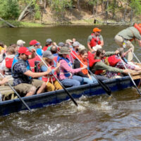 Place-Based Workshop participants ride on a boat at Upham Woods Outdoor Learning Center. Photo credit: Tricia Gorby