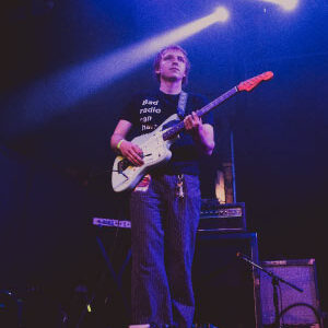 Lucas playing guitar for she’s green at the Varsity Theater in Minneapolis. Photo by Nick Greseth