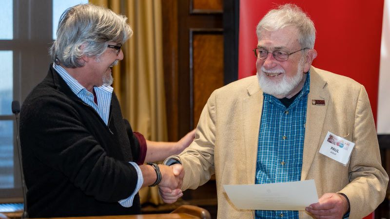 Dean Paul Robbins (left) recognizes Professor Paul Zedler, who recently announced his retirement.