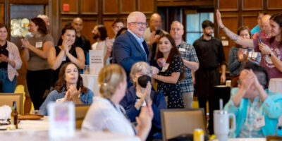 Nathan Schulfer (center) upon hearing he was selected to receive the inaugural Nelson Institute Outstanding Staff Accomplishment Award.