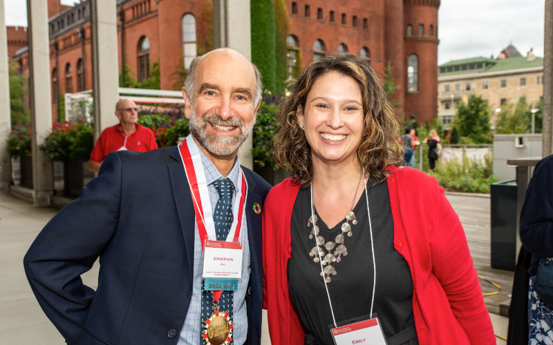 Jonathan Patz (left), who was honored as the John P. Holton Chair in Health and the Environment, and Emily Reynolds, director of community engagement and alumni relations. Photo credit: Ingrid Laas