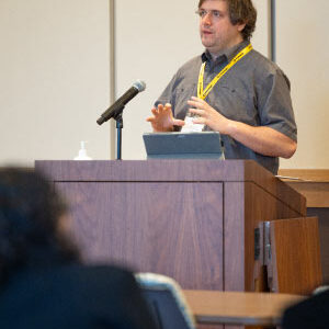 Hall presents his Costa Rica biobanking work with Francisco Pelegri at the Promega campus in Fitchburg, Wisconsin, where he also received the Promega DOORS scholarship in March 2023. Photo courtesy of Rob Hall