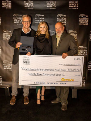 Haag pictured with Sam Moulton (L), VP Ad Marketing and Sale Strategy at Outside, and (R) Joe Eberhardt, CEO Jaguar Land Rover North America after the GLA was announced as the winner of the Environmental and Conservation category for the Land Rover™’s Defender Service Award. Photo courtesy of Taylor Haag