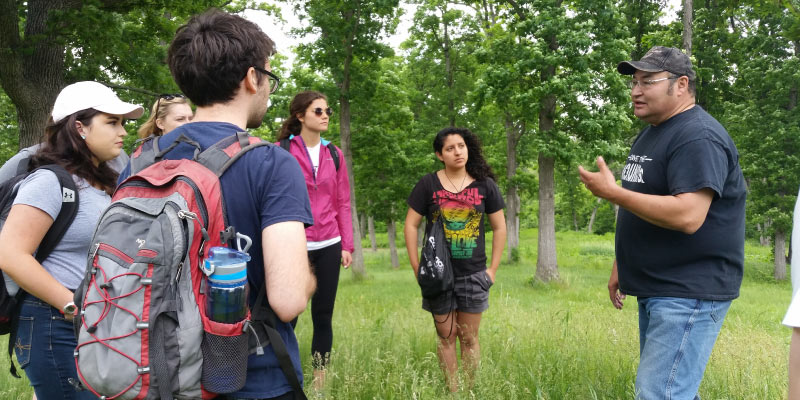 During the 2016-2017 academic year, students in Environmental Studies 600 worked with the Ho-Chunk Nation and City of Monona through the UniverCity Year program to preserve Ho-Chunk history and culture in parks. Photo by Jessie Conaway