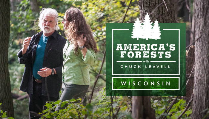 Chuck Leavell and a woman having a discussion in a forest