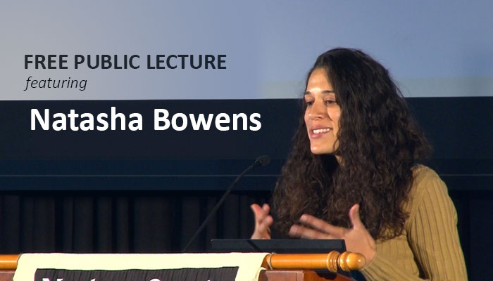 Natasha Bowens speaking at a podium