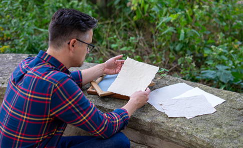 A person looking at vintage papers