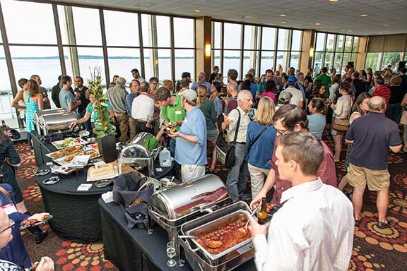 Alumni mingling during a reception at Rendezvous on the Terrace