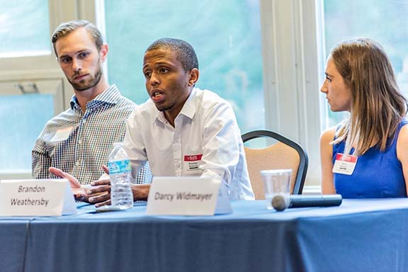 Alumni talking about their careers during a panel discussion