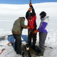 Researchers collecting a core sample in St. Paul, Alaska