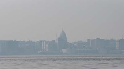Wildfire smoke adds a blue-gray haze to the Madison skyline