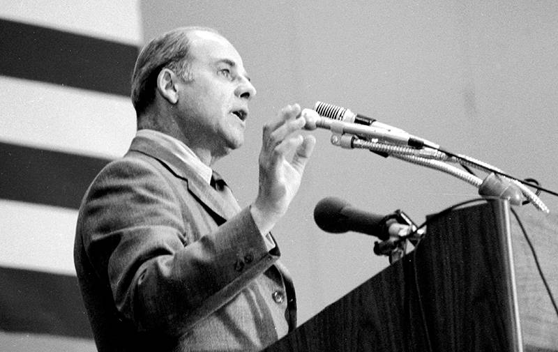 Gaylord Nelson speak at a podium during the Earth Day conference in 1970