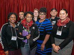 Monica White and Public Allies of Milwaukee posing for a photo during an Earth Day conference